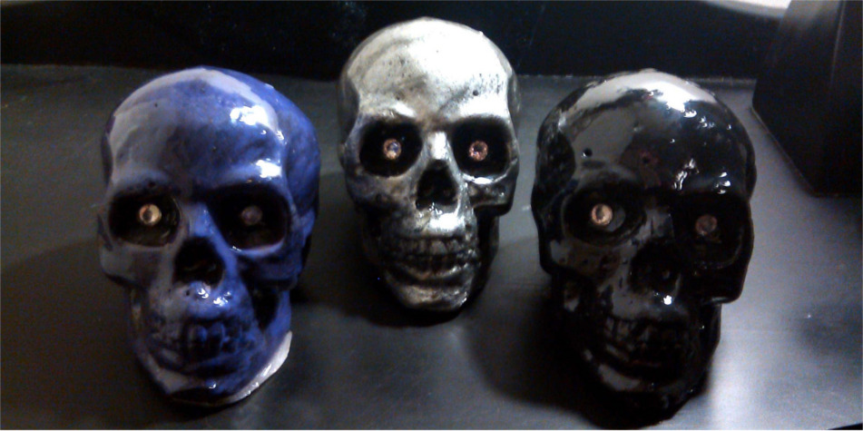 "Large Painted Concrete and Resin Coated Skulls - Purple, Chrome, and Black - Swarovski Crystal Element Eyes"